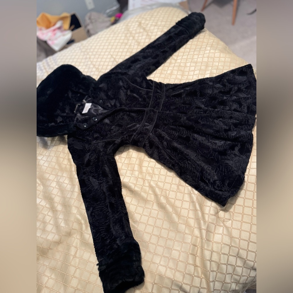 Black furry coat.